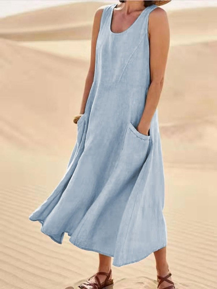 Woman styling a sleeveless linen maxi dress with sandals for a summer daytime look