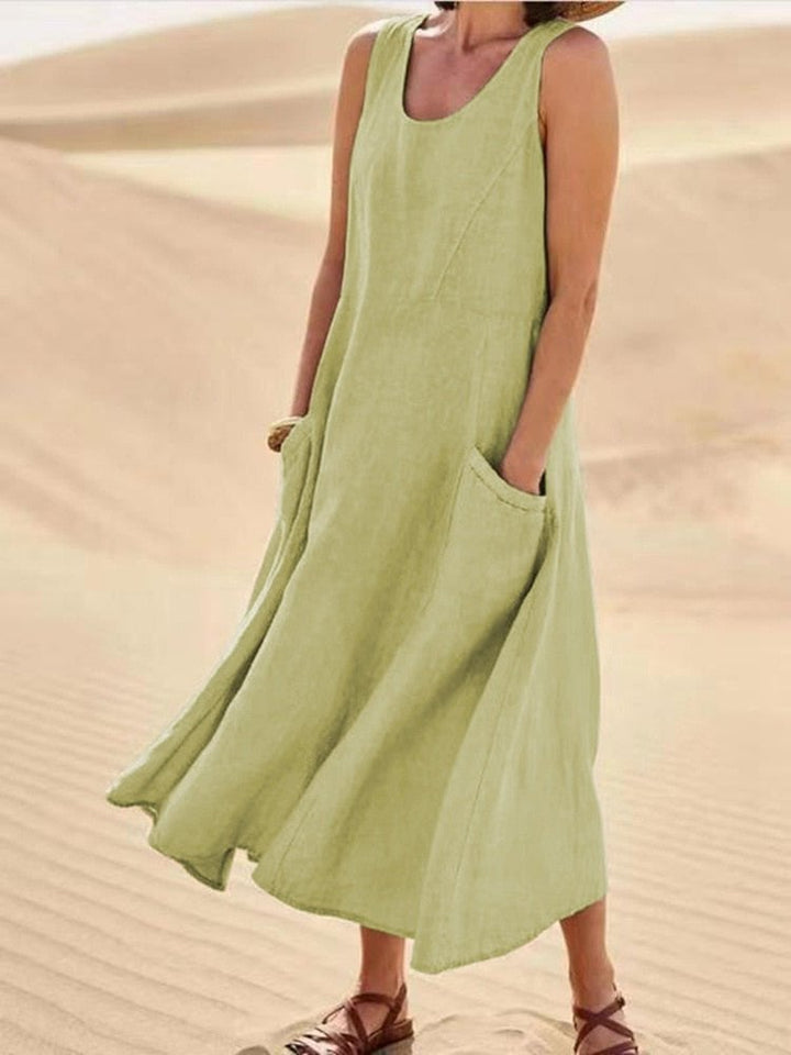 Flat lay of a sleeveless linen maxi dress showing available colors including pink, khaki, and light blue