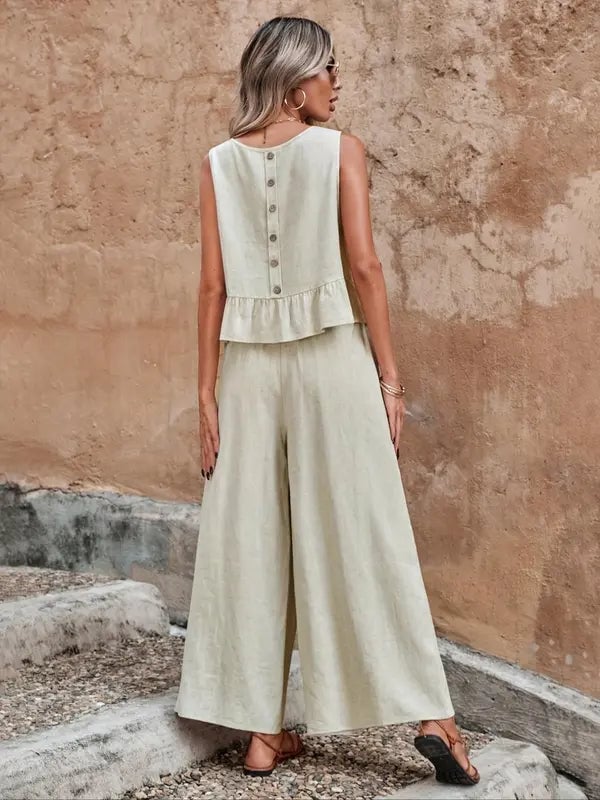 Close-up detail of khaki wide leg pants and ruffle-hem sleeveless top from a women's two-piece co-ord set