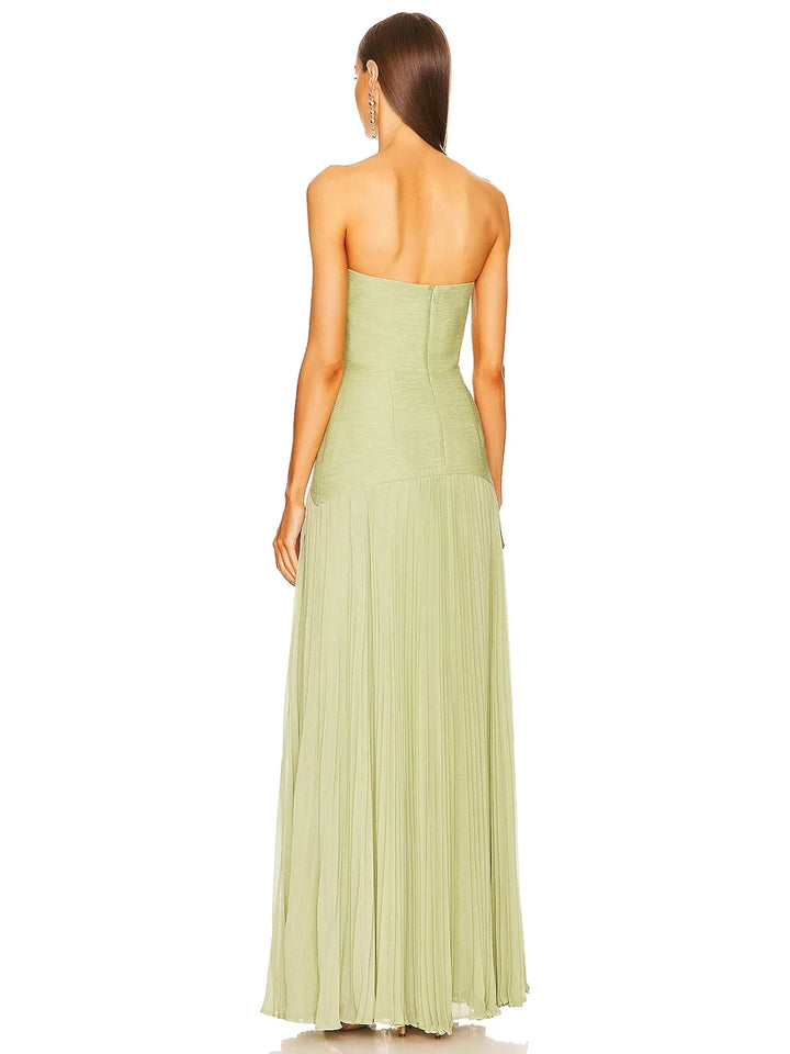 Close-up of the fine uniform pleating on the full-length skirt of the sage green formal gown