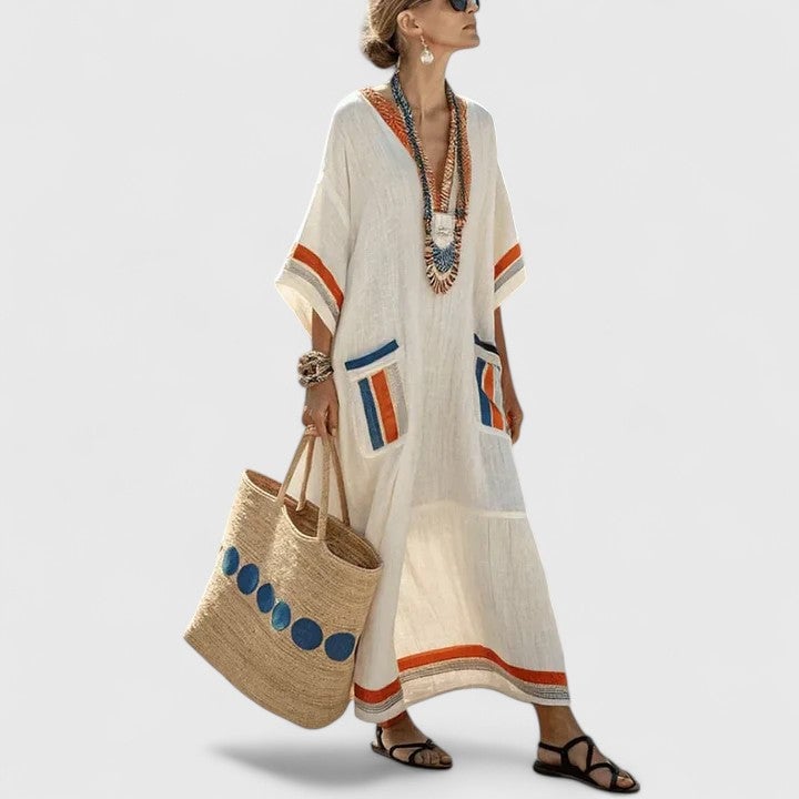Women wearing striped linen maxi dress at an outdoor setting — lifestyle shot