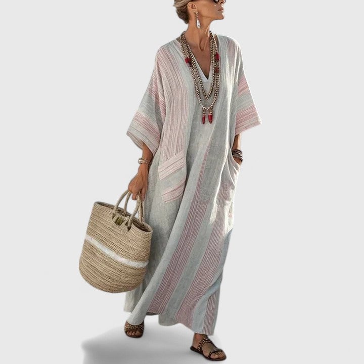 Striped linen maxi dress shown in orange colorway — front view