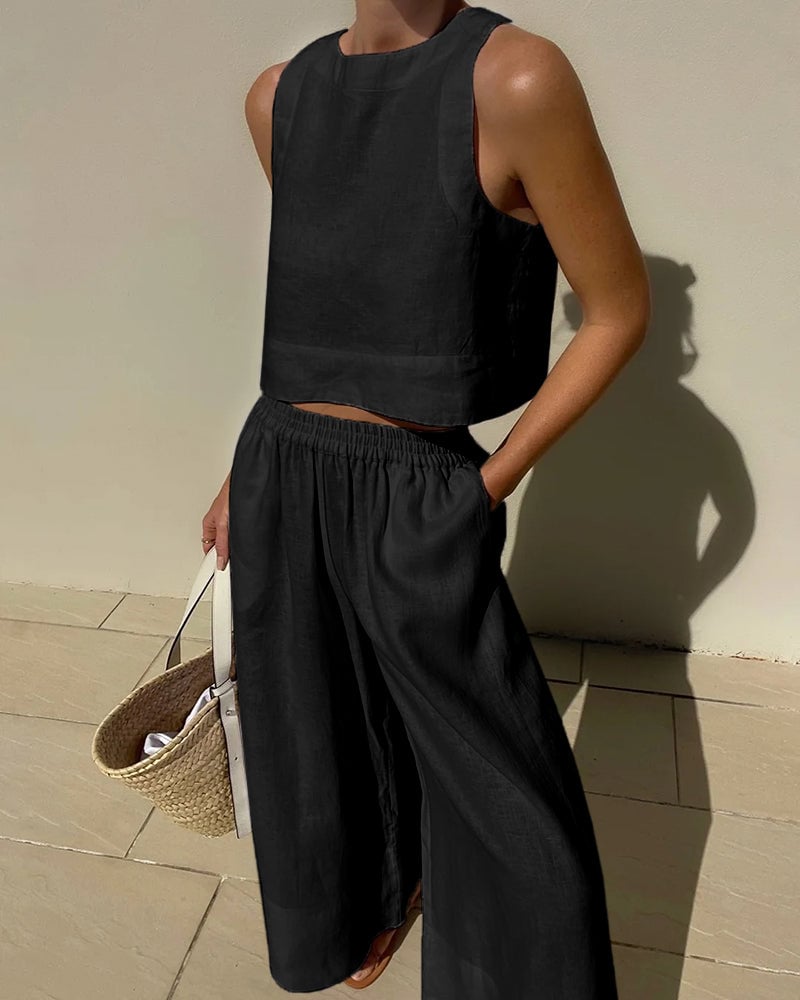 Salina two-piece set in white, side view showing wide-leg silhouette and crop top length