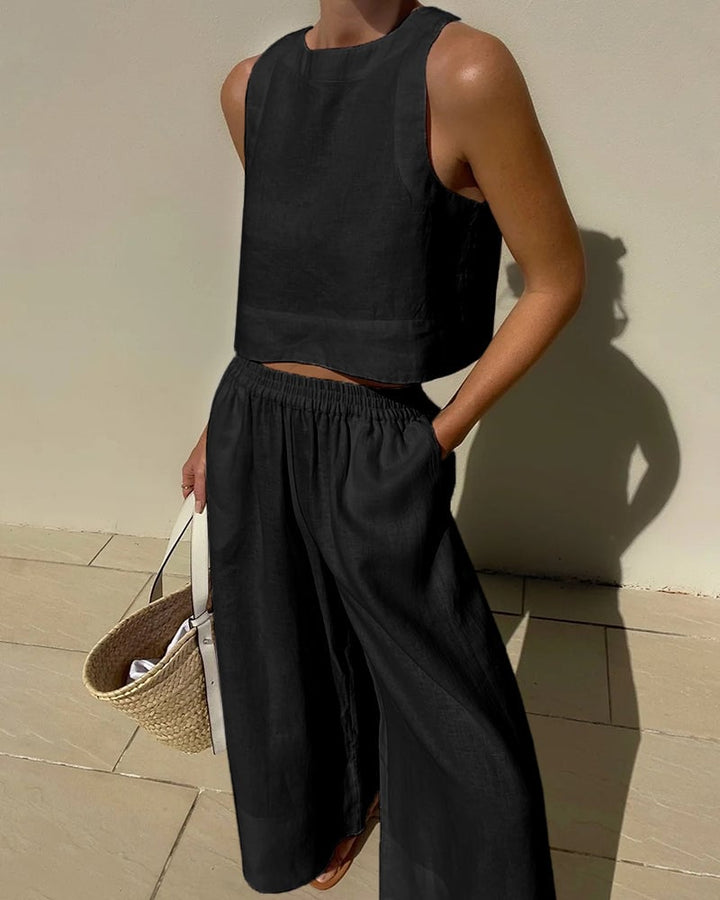 Salina two-piece set in white, side view showing wide-leg silhouette and crop top length