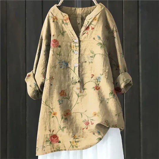 Sally top in multicolor print displayed flat to show the relaxed shape and length