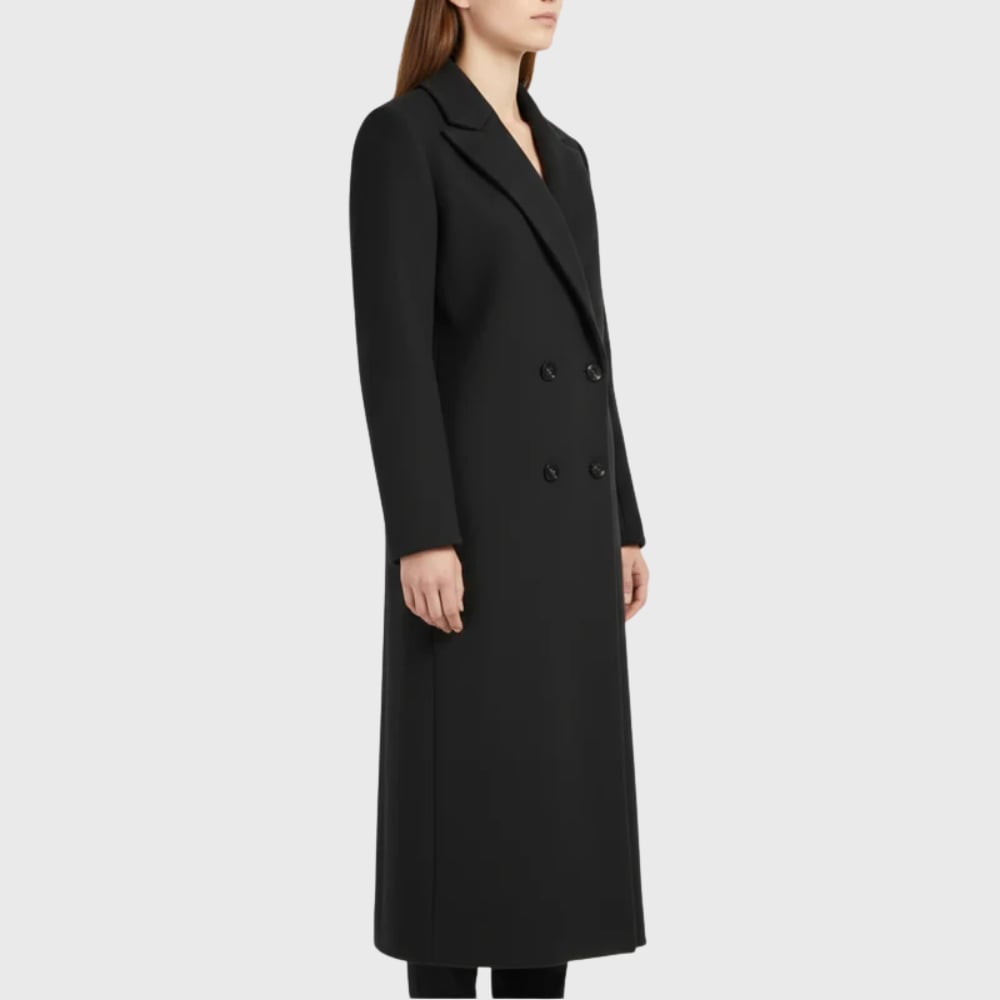Model wearing longline winter trench coat in blue with casual outfit underneath