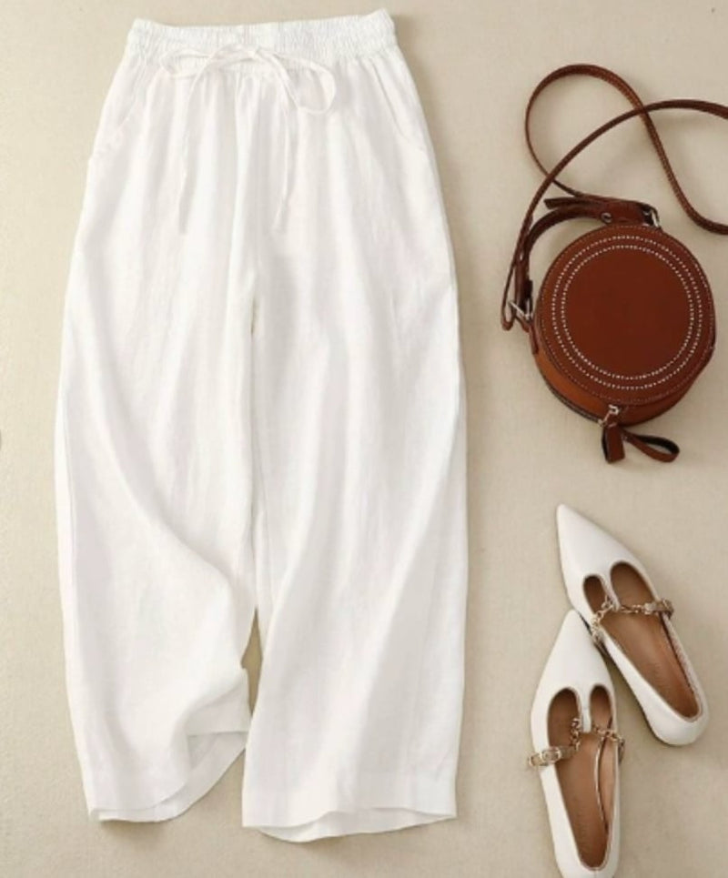 Close-up of the natural texture fabric and gathered waistband detail on the Sandra wide-leg pants