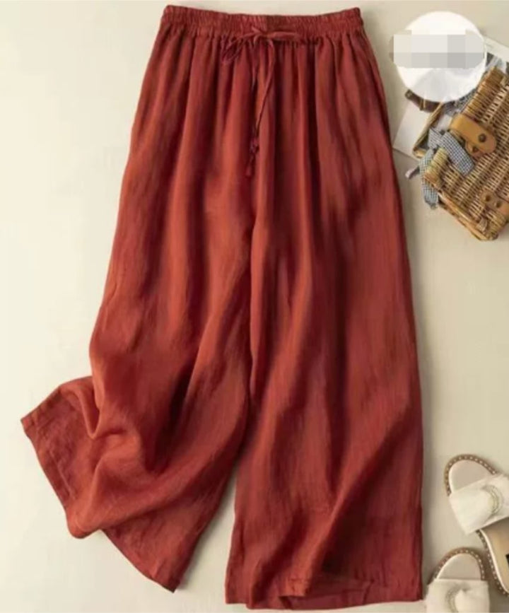 Full-length view of the Sandra wide-leg pants showing the loose, breezy drape from hip to hem