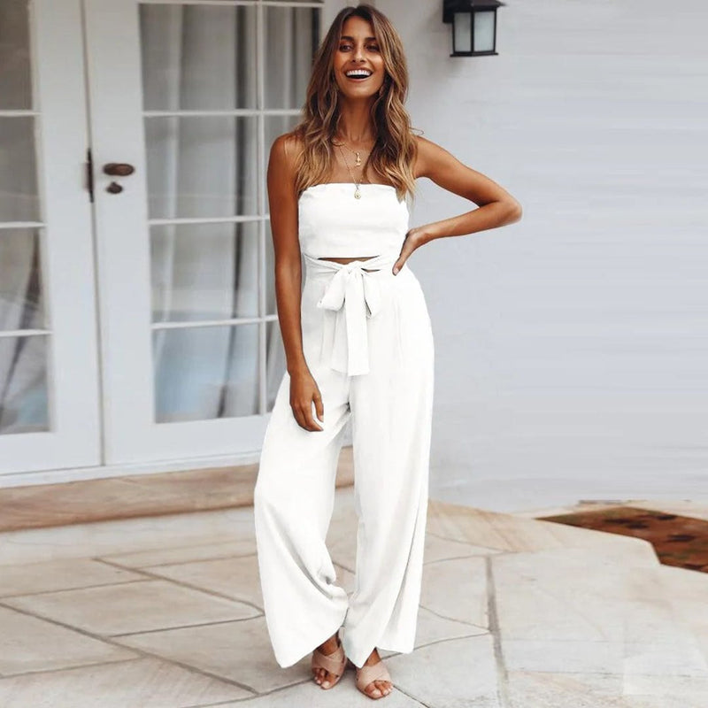 Close-up of the self-tie waist sash bow on the Sandy wide-leg jumpsuit in beige