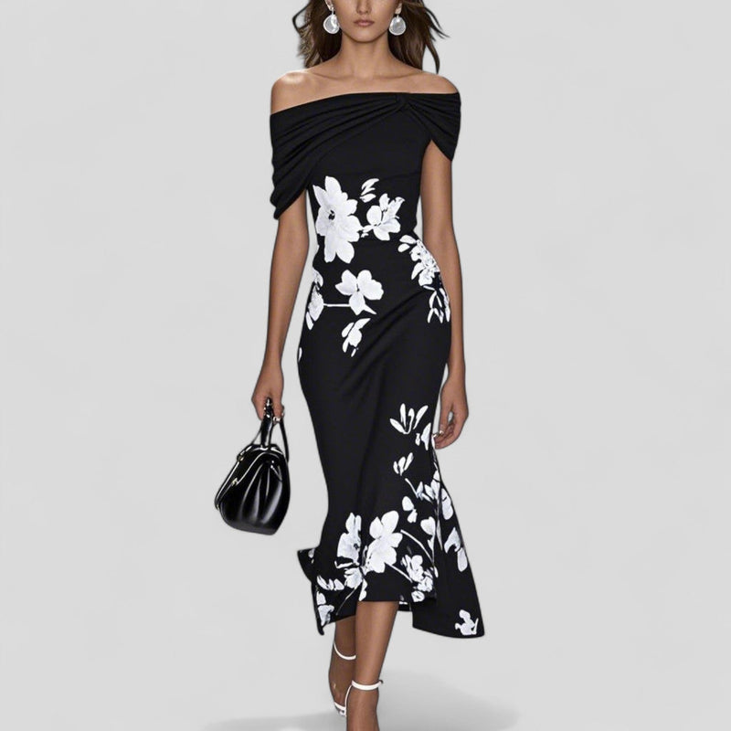 Close-up of the Sania dress ruffle fishtail hem detail showing flowy movement and floral print