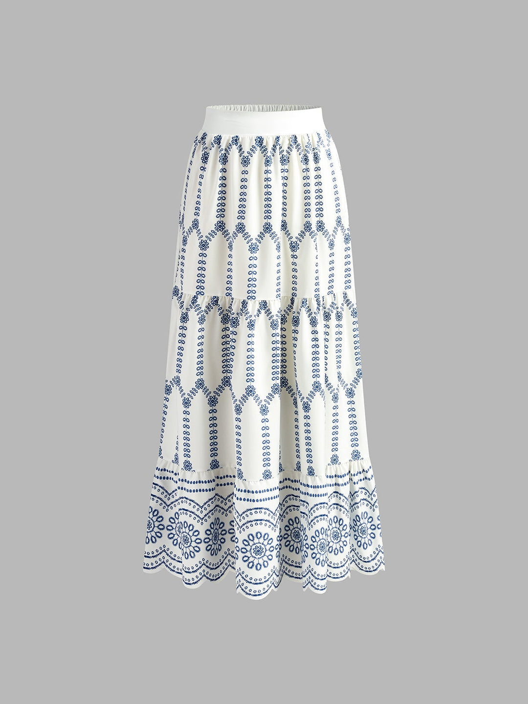 Full-length side view of the flowing tiered maxi skirt with scalloped border hem