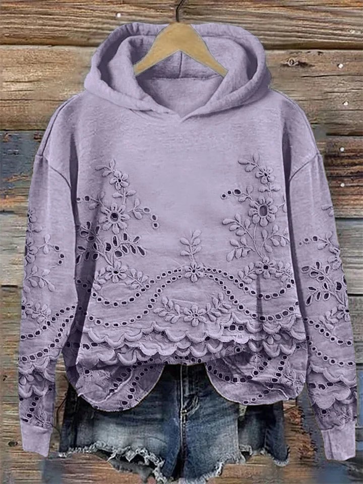 Women's floral hoodie shown from the front in a relaxed fit