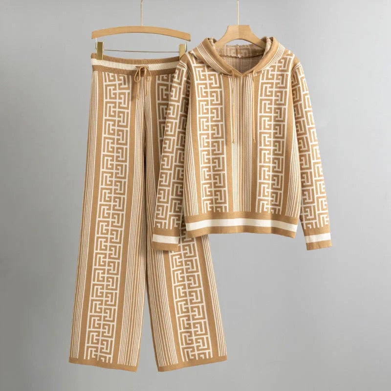 Woman wearing a matching beige cozy hoodie and pants set with a relaxed modern fit