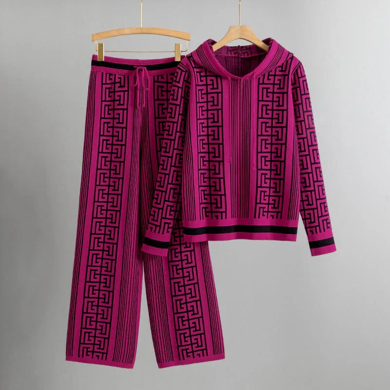 Flat lay of the Savannah hoodie and pants set in fuchsia showing the full matching ensemble