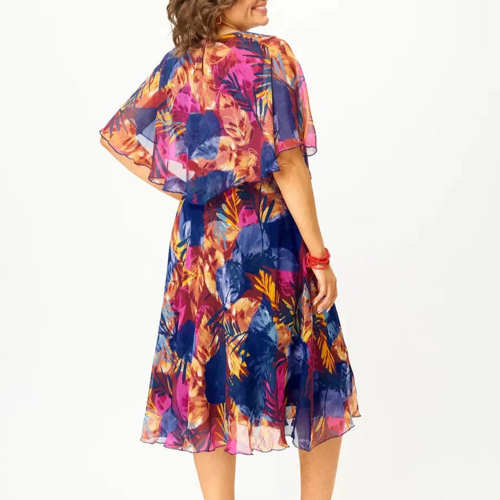 Full-length view of the Savannah chiffon flowy dress styled for a special occasion