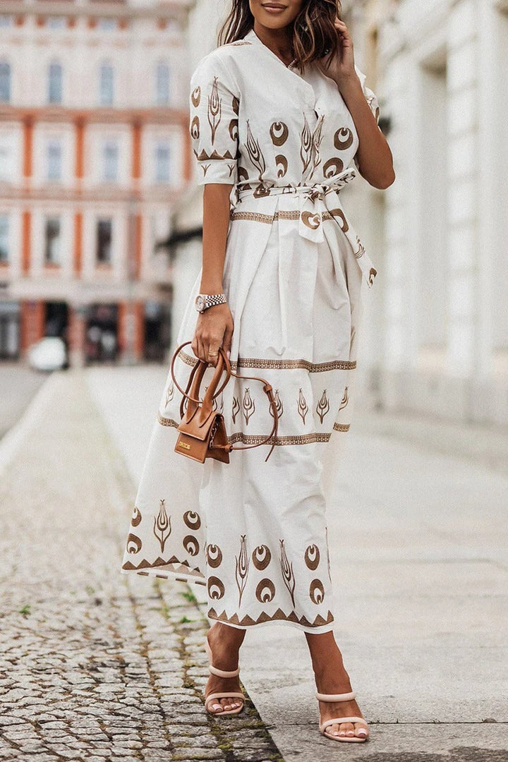 Close-up of the boho geometric and crescent print detail on the Savannah midi dress in white