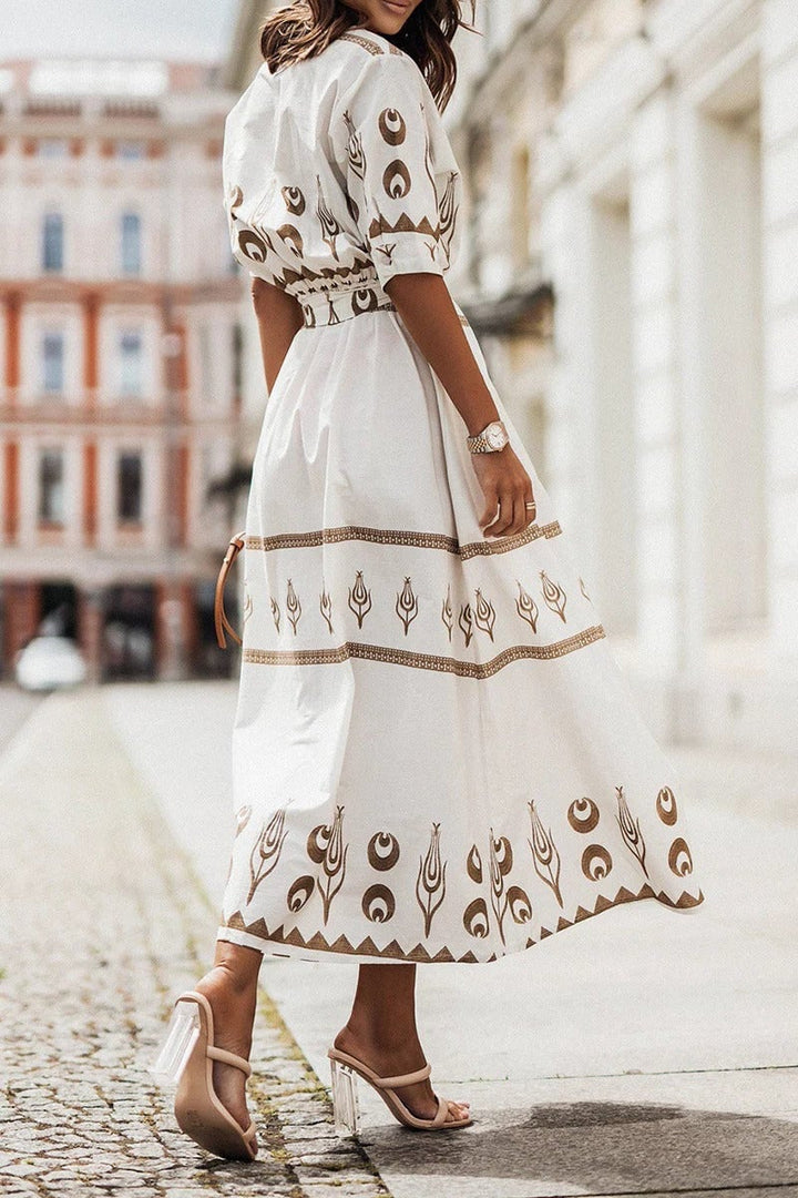 Side view of the Savannah belted midi dress in black highlighting the flowing A-line skirt