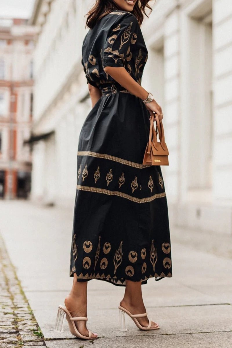 Back view of the Savannah boho print belted midi dress in white showing the relaxed fit and midi length