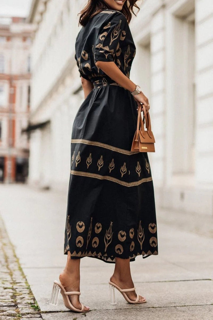 Back view of the Savannah boho print belted midi dress in white showing the relaxed fit and midi length