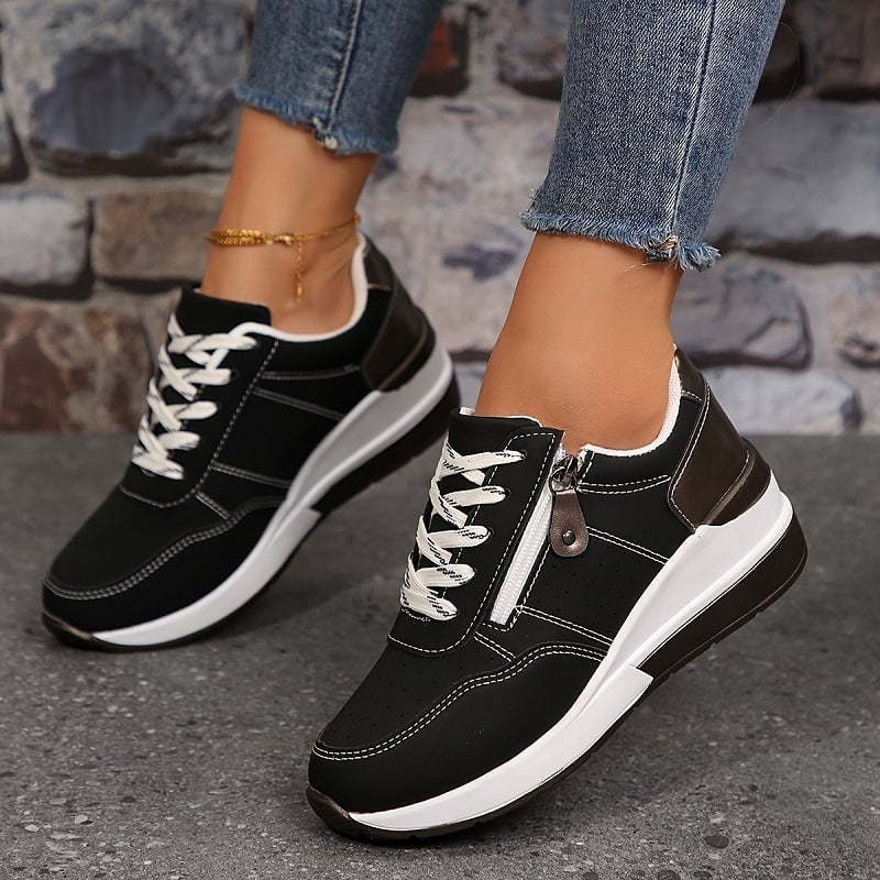 Scarlett orthopedic sneaker in Venice Black, front three-quarter angle highlighting ventilated upper
