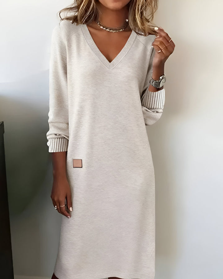 Model wearing the Scarlett midi dress in white, showing the full-length flattering silhouette from the front