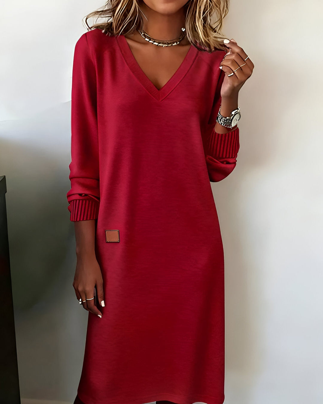 Model wearing the Scarlett midi dress in brown, styled with heels for an elegant day-to-night look