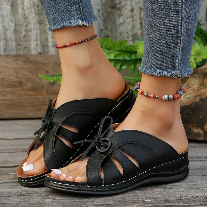 Scarlett women's sandals in black, top-down view highlighting clean strap layout