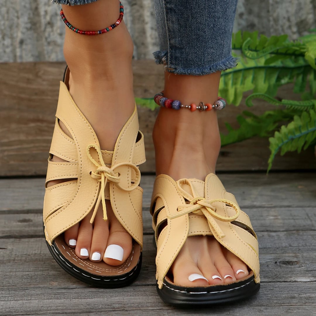 Scarlett women's sandals in dark blue, side view showing low profile sole