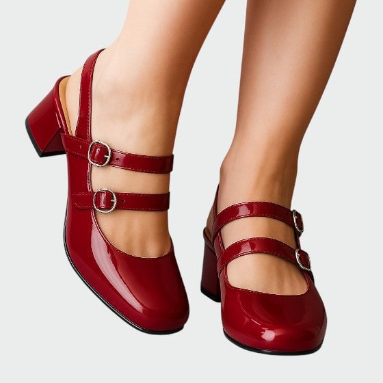 Scarlett glossy red patent double-strap mary jane block heel pumps, front three-quarter view showing buckle straps and rounded toe