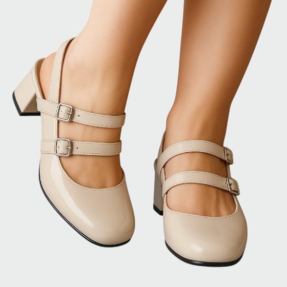Scarlett beige patent double-strap mary jane pumps front view showing adjustable buckle straps and rounded toe box