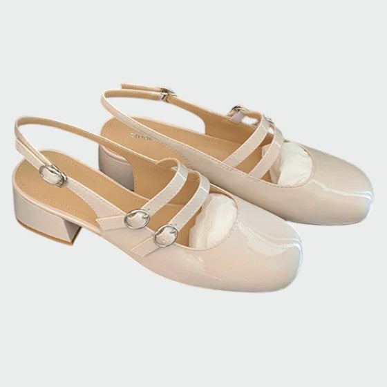 Scarlett beige patent mary jane block heel pumps angled view showing sole and heel construction