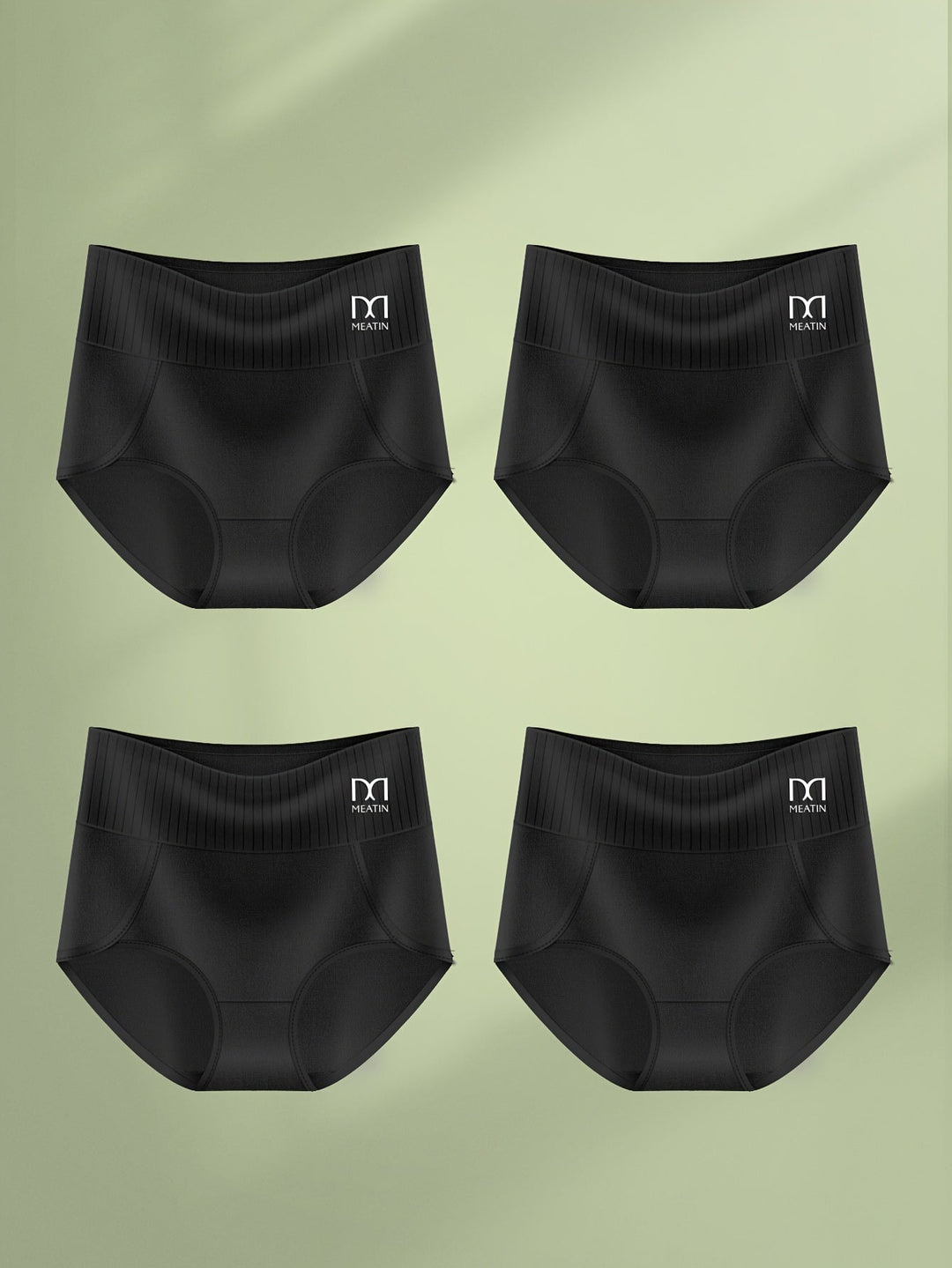 Woman wearing green high-waist shaping briefs showing flexible, body-adaptive fit