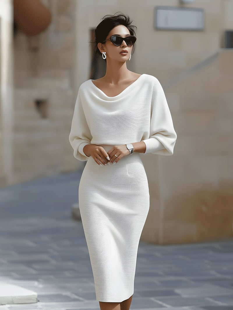Woman wearing the Selah luxurious midi dress in a smooth, fluid fabric with a flattering feminine silhouette