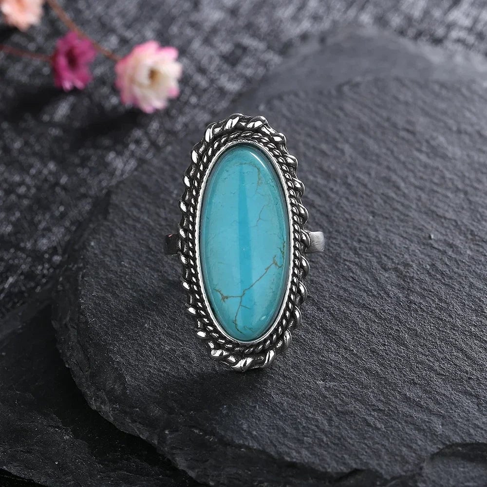 Top-down flat lay view of the turquoise ring on a clean surface
