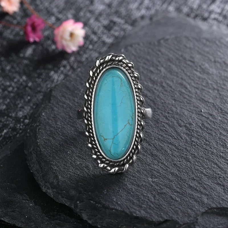 Top-down flat lay view of the turquoise ring on a clean surface