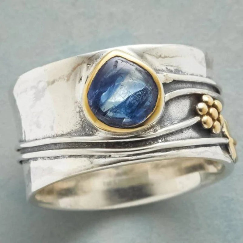 Selene vintage blue stone ring with intricate band detail, shown in sizes 6 through 10