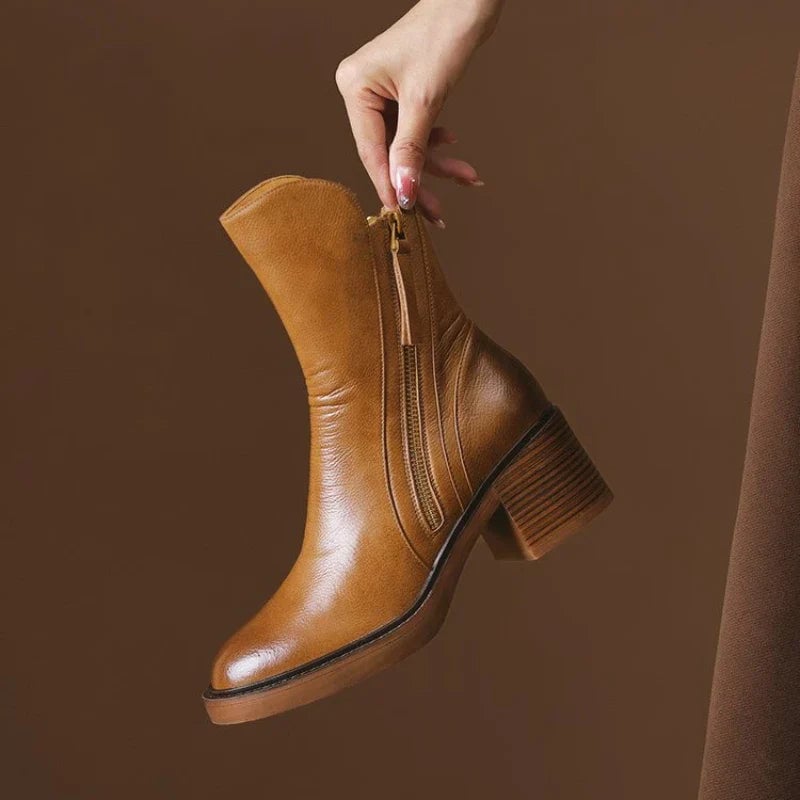 Selene ankle boots in brown with a sleek, polished silhouette on a clean background