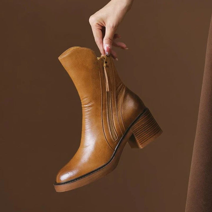 Selene ankle boots in brown with a sleek, polished silhouette on a clean background