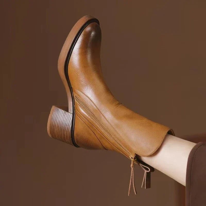 Side profile of Selene ankle boots showing the streamlined design in black