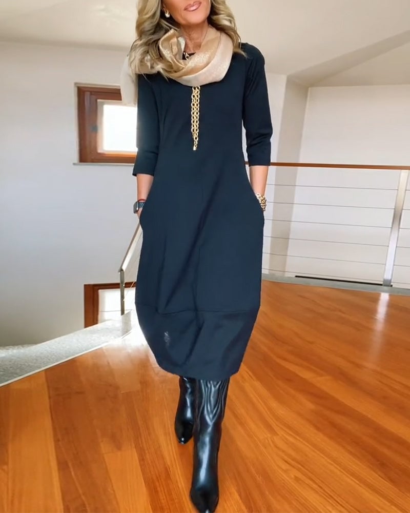 Front view of the Seraphina elegant flattering dress in black with a tailored silhouette