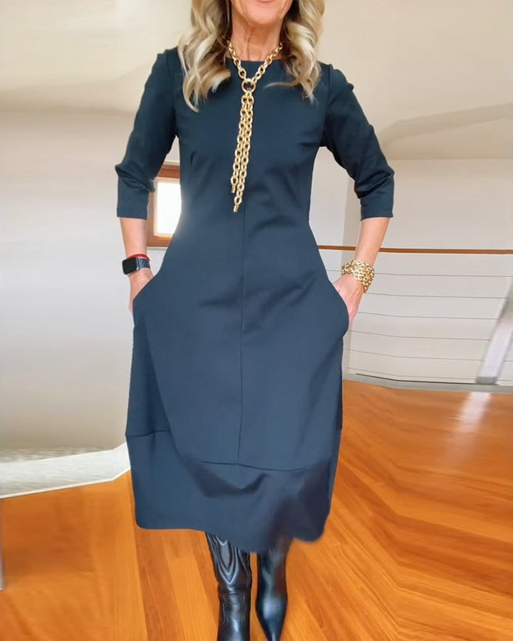 Full-length front view of the Seraphina dress in brown on a model