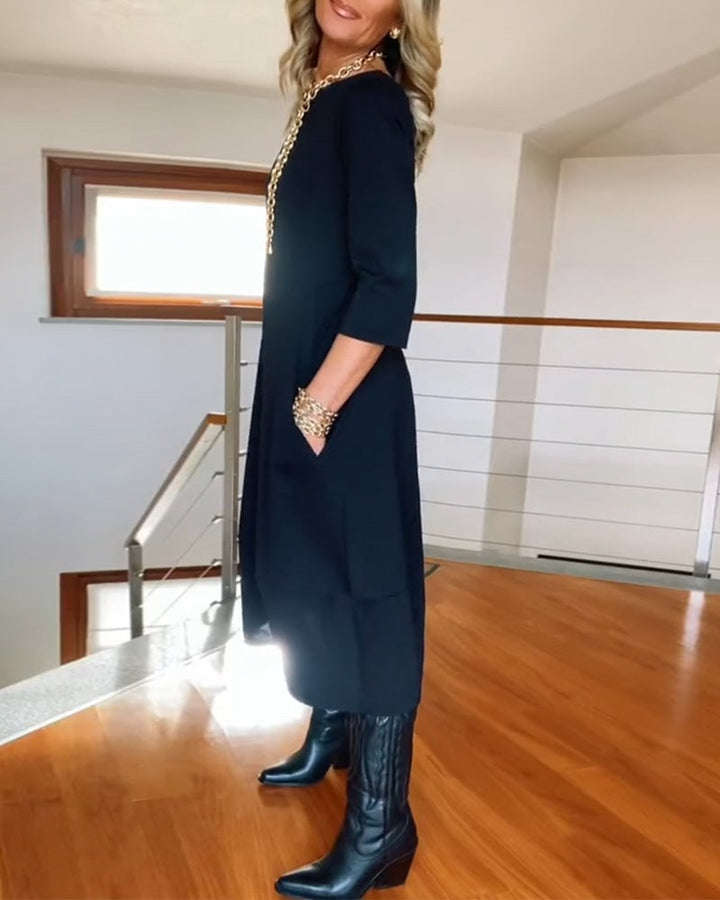 Side profile of the Seraphina dress in brown showing the slimming silhouette