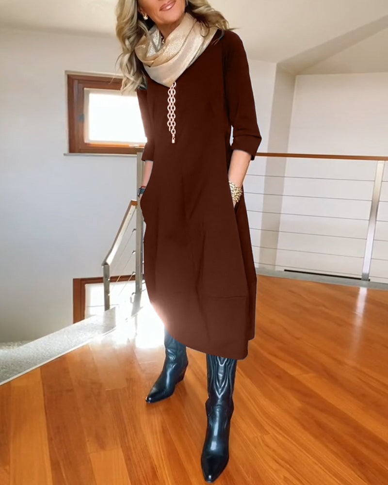 Close-up of the Seraphina dress neckline and shoulder detail in burgundy