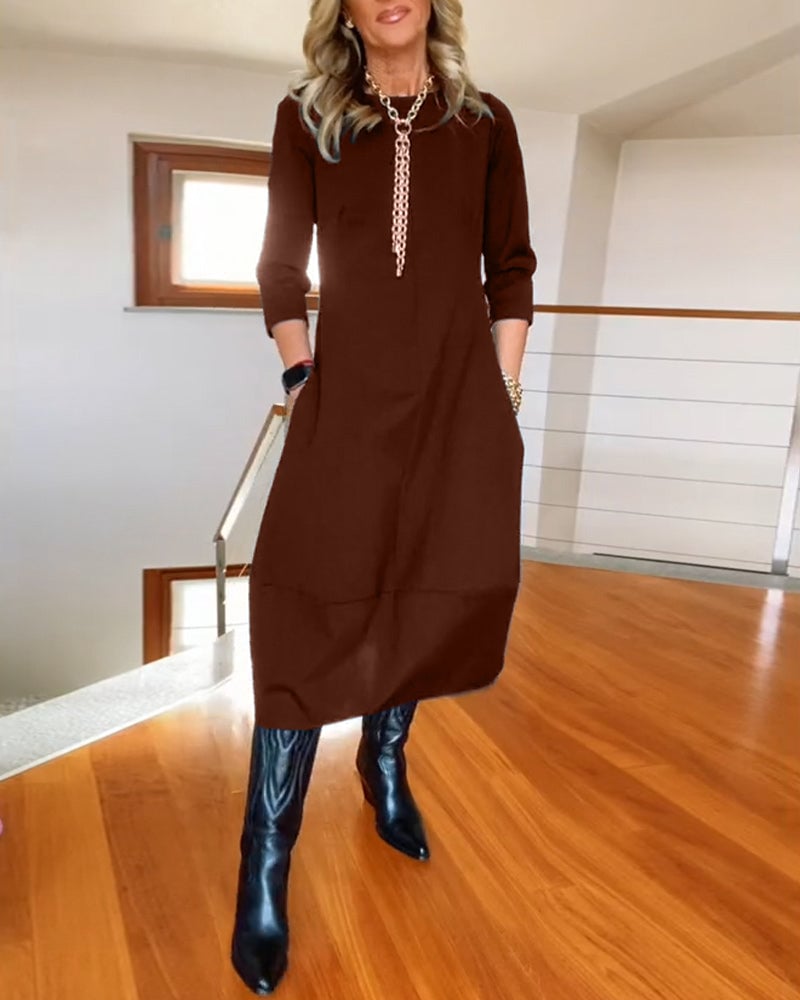 Full-length view of the Seraphina dress in green with elegant draping