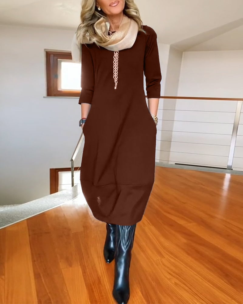 Side view of the Seraphina dress in green showing sleeve and length detail