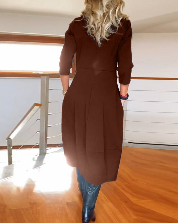 Model wearing the Seraphina dress in black in an office-ready styling