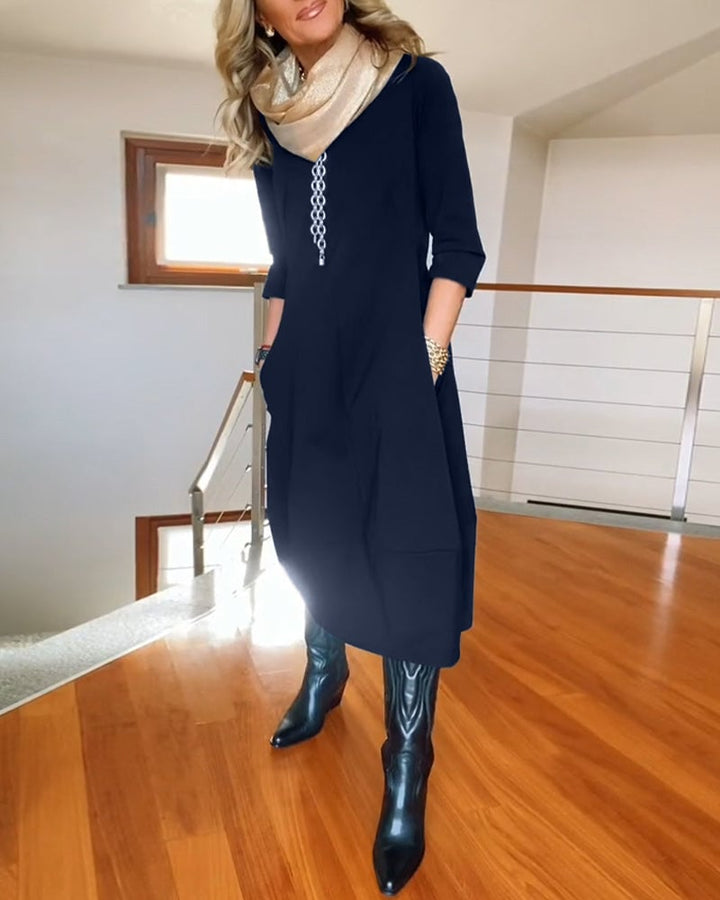 Seraphina dress in marine blue shown at full length on a model