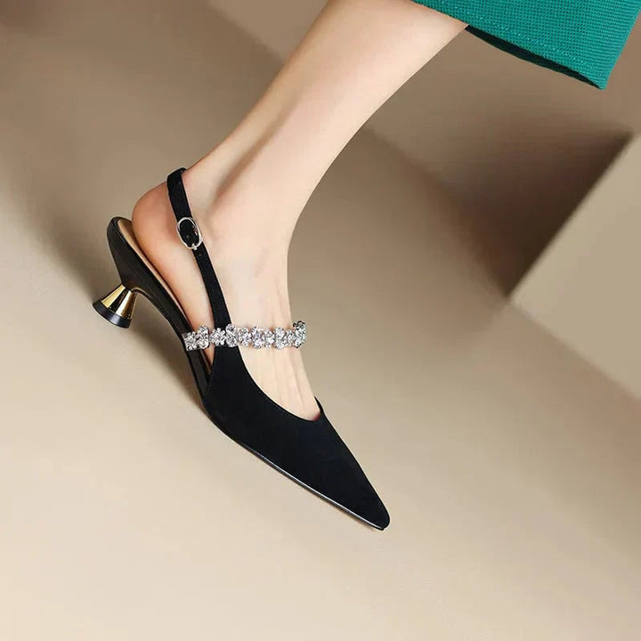 Side profile of black Seraphina pointed toe slingback heel