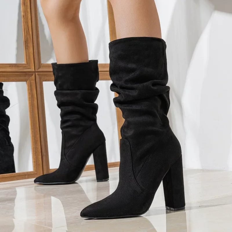Model wearing Florimay Serena slouchy boots in black paired with skinny jeans