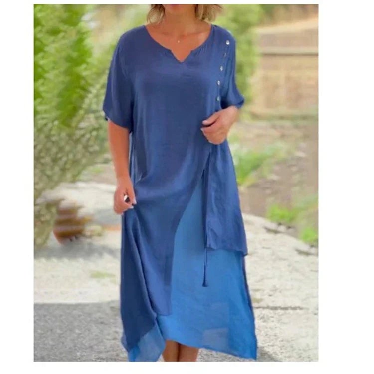 Front view of the Serena layered midi dress in blue showing the short rolled sleeves and flowing silhouette